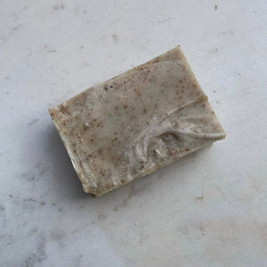 A single coffee exfoliating bar of soap on marble The Herbal Gardener
