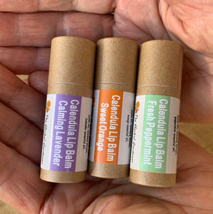 Three Calendula lip balms with three scents of calming lavender, sweet orange and fresh peppermint The Herbal Gardener
