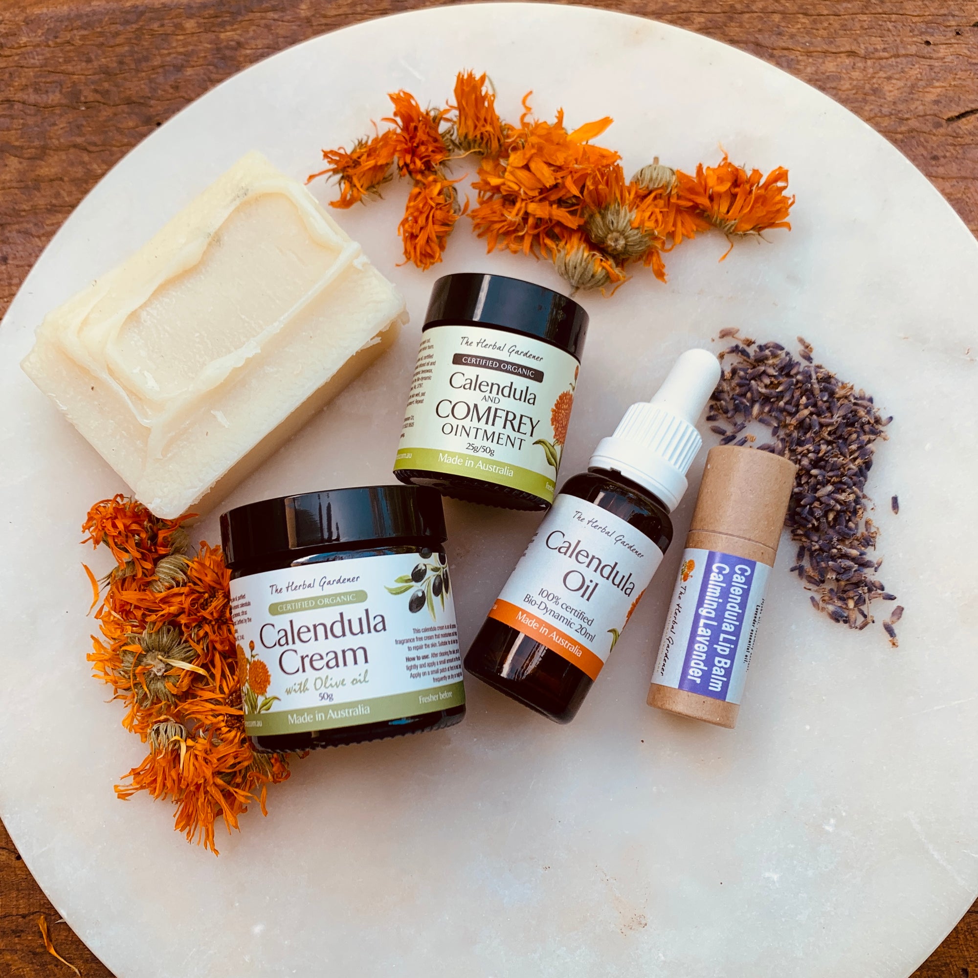 The Postpartum Care Pack includes the Calendula Cream 50gr, Calendula and Comfrey Ointment 25gr, Calendula Oil 20mL, Calendula Lip Balm and Natural Soap The Herbal Gardener