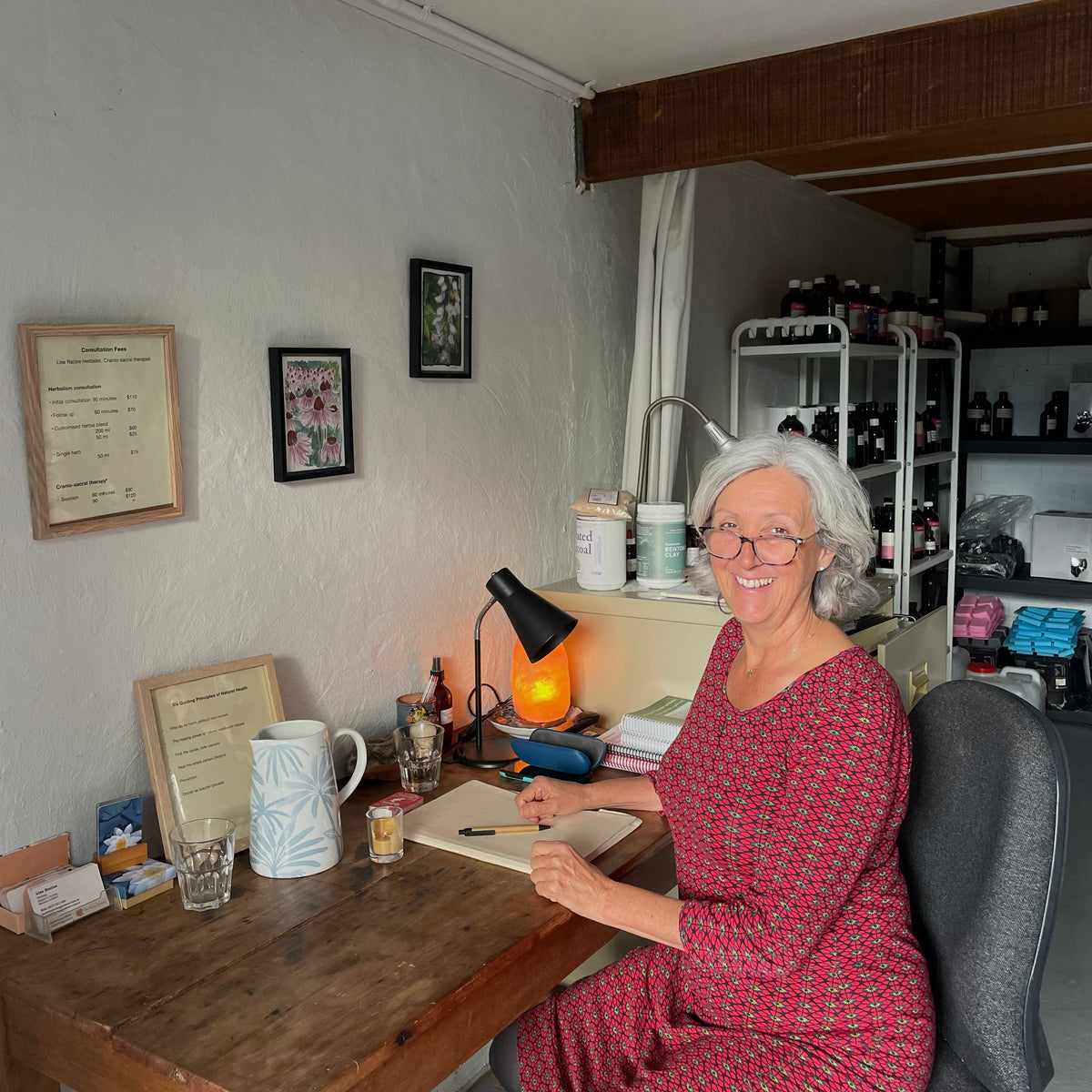 Lise Racine, founder of The Herbal Gardener sitting in her herbalist consultation space Tallebudgera
