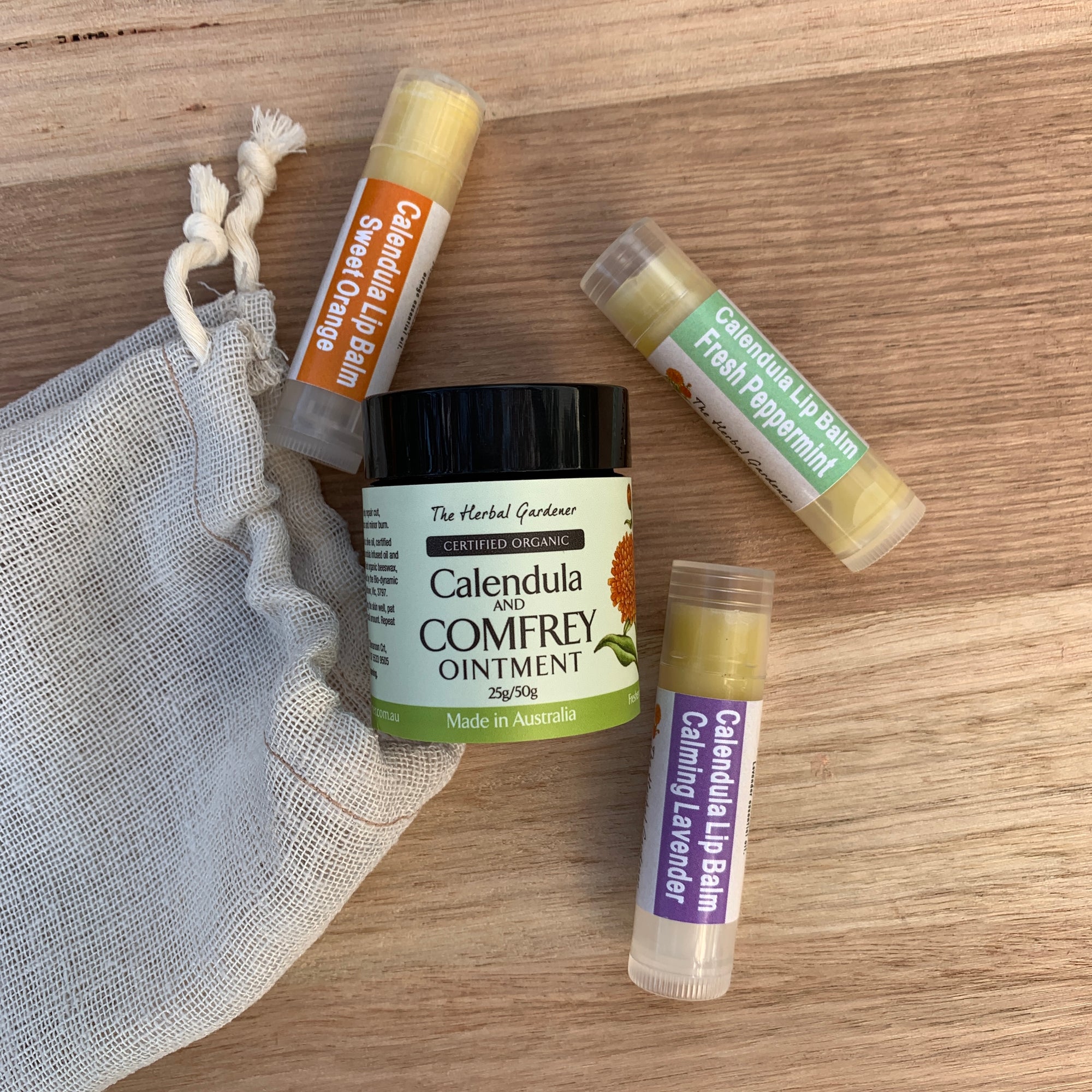 Calendula Lip Care Collection with three lip balms of calming lavender, sweet orange and fresh peppermint and calendula and comfrey ointment 25gr The Herbal Gardener