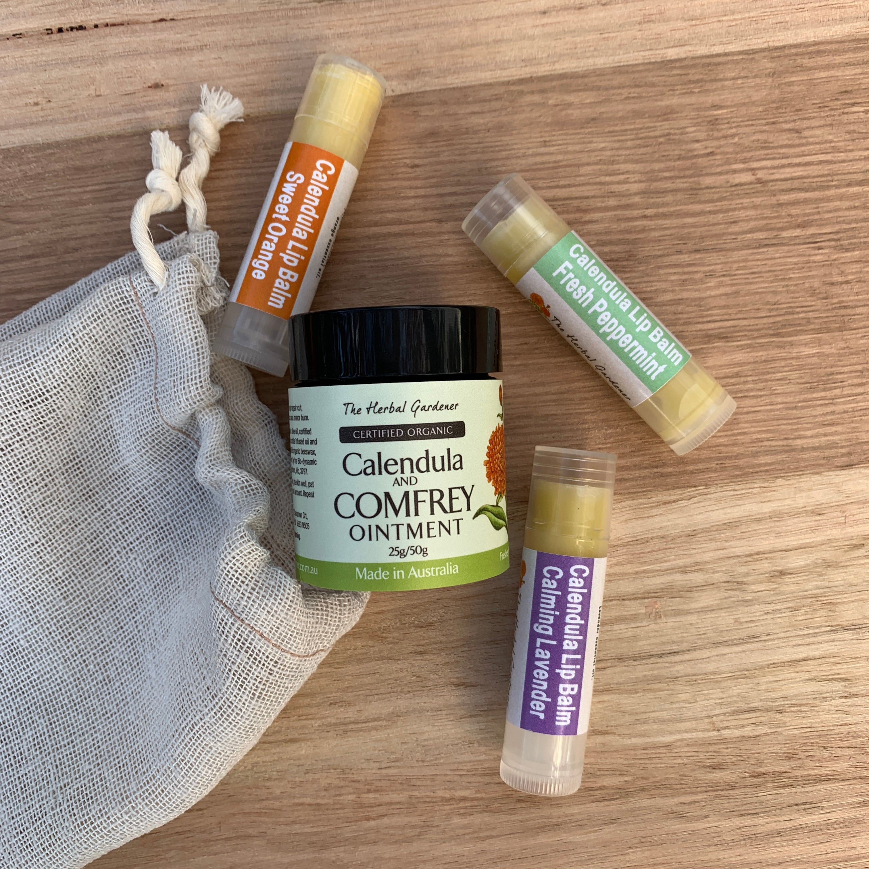 Calendula Lip Care Collection with three lip balms of calming lavender, sweet orange and fresh peppermint and calendula and comfrey ointment 25gr The Herbal Gardener