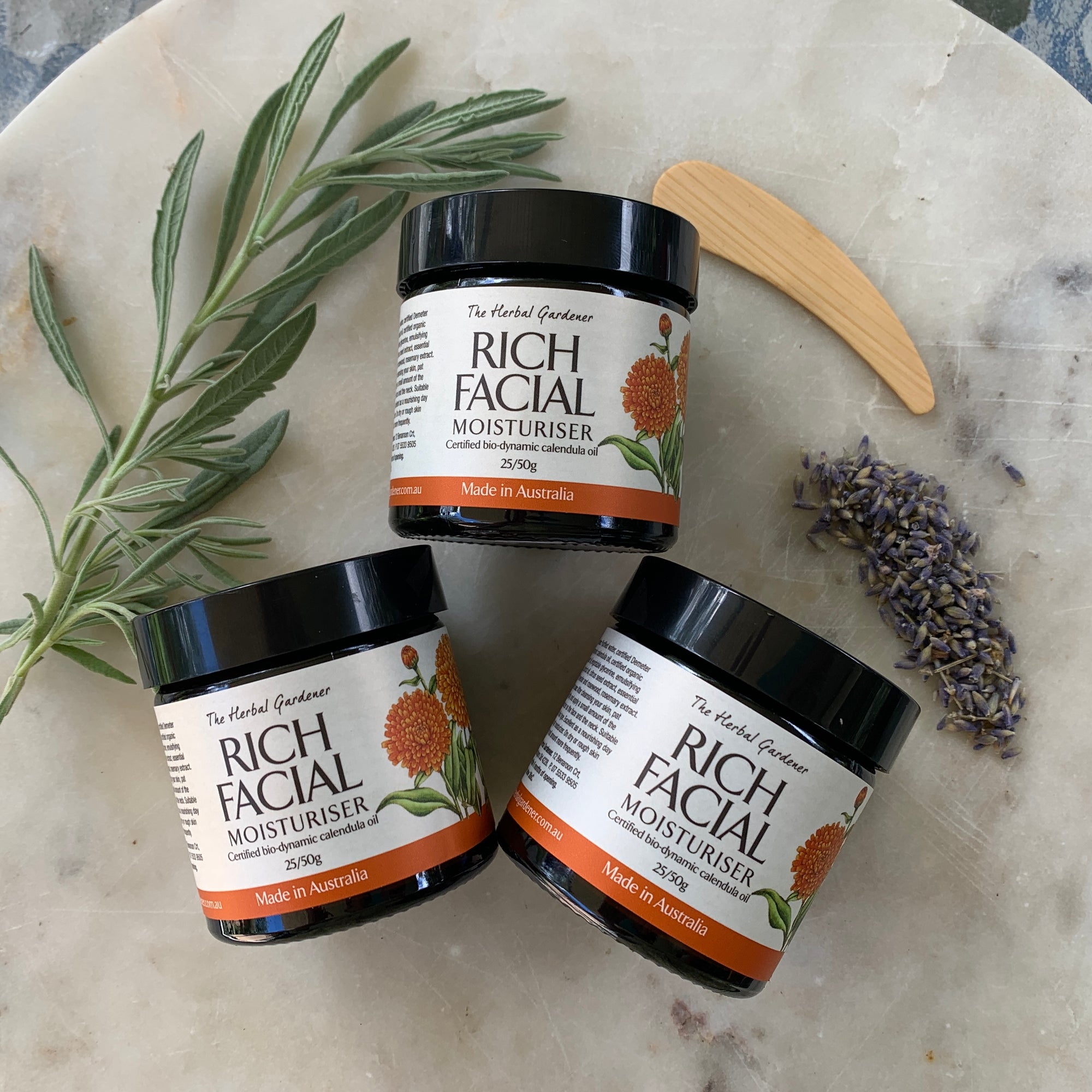 Rich Facial Moisturiser Three Pack 50gr each with a wooden spoon and dried lavender The Herbal Gardener.